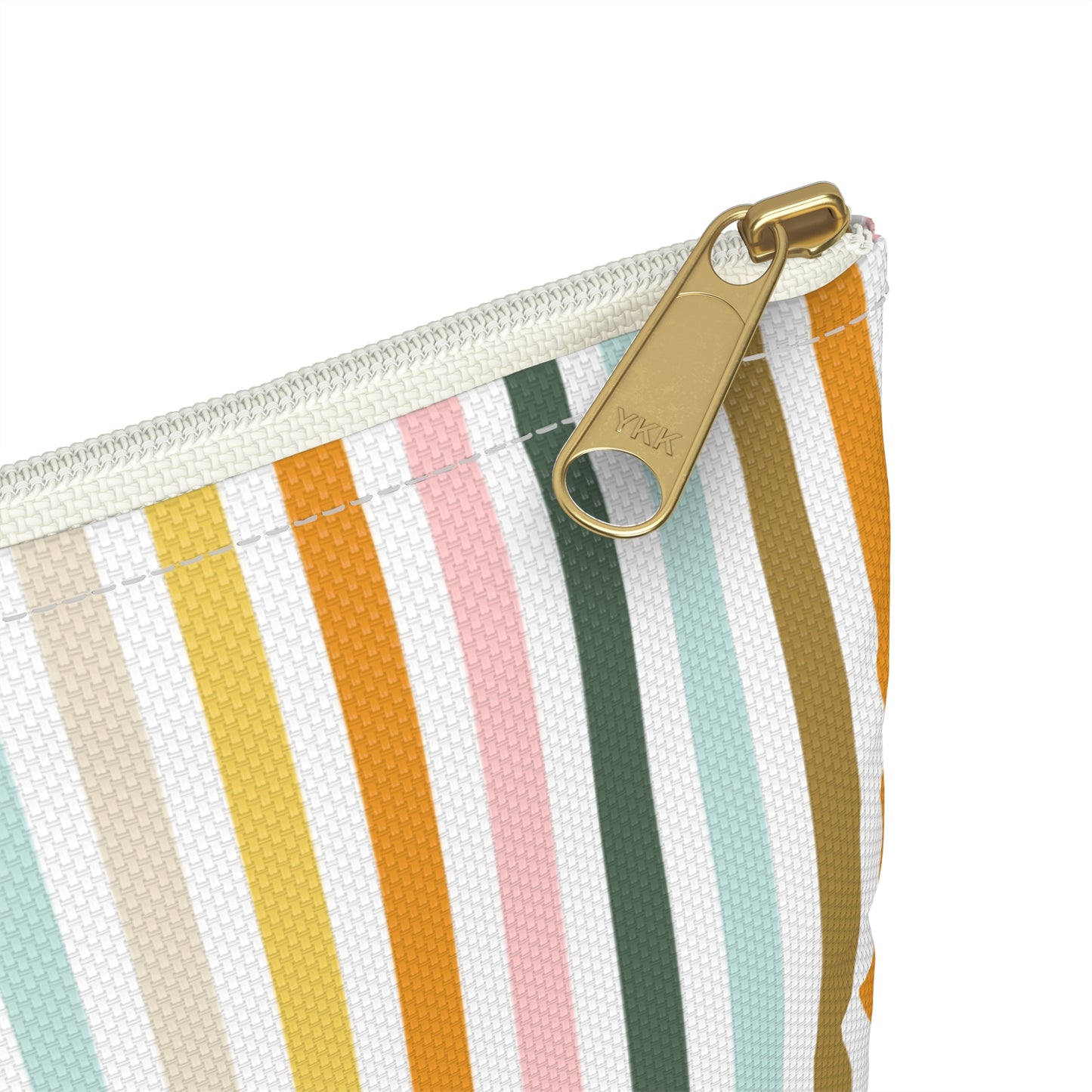 Close-up of a striped pouch with a gold zipper pull on a white background