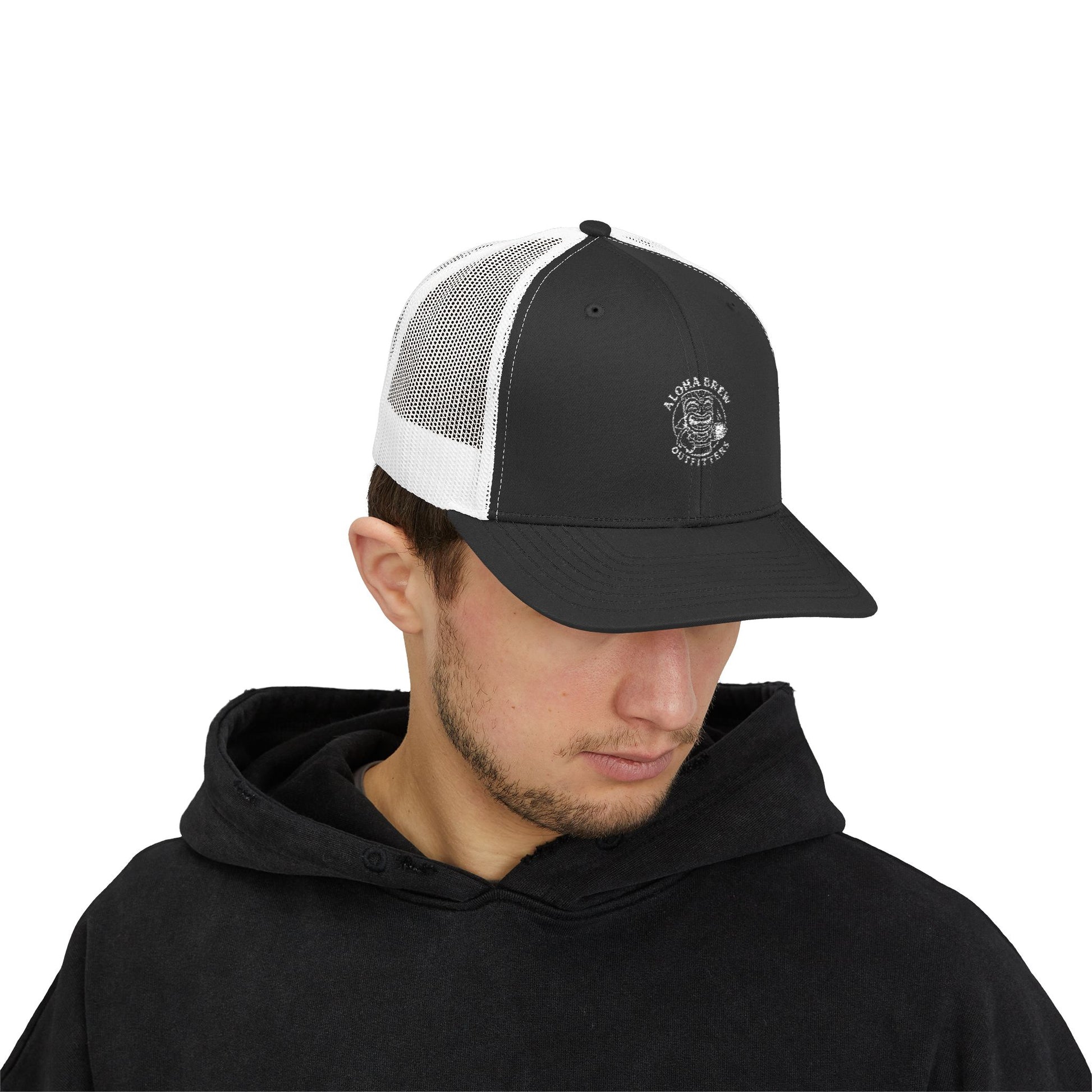 Man wearing a black and white cap with a logo on a white background