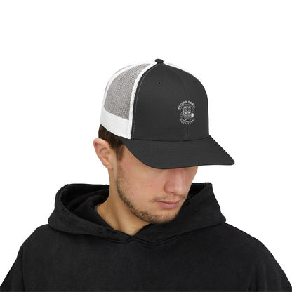 Man wearing a black and white cap with a logo on a white background