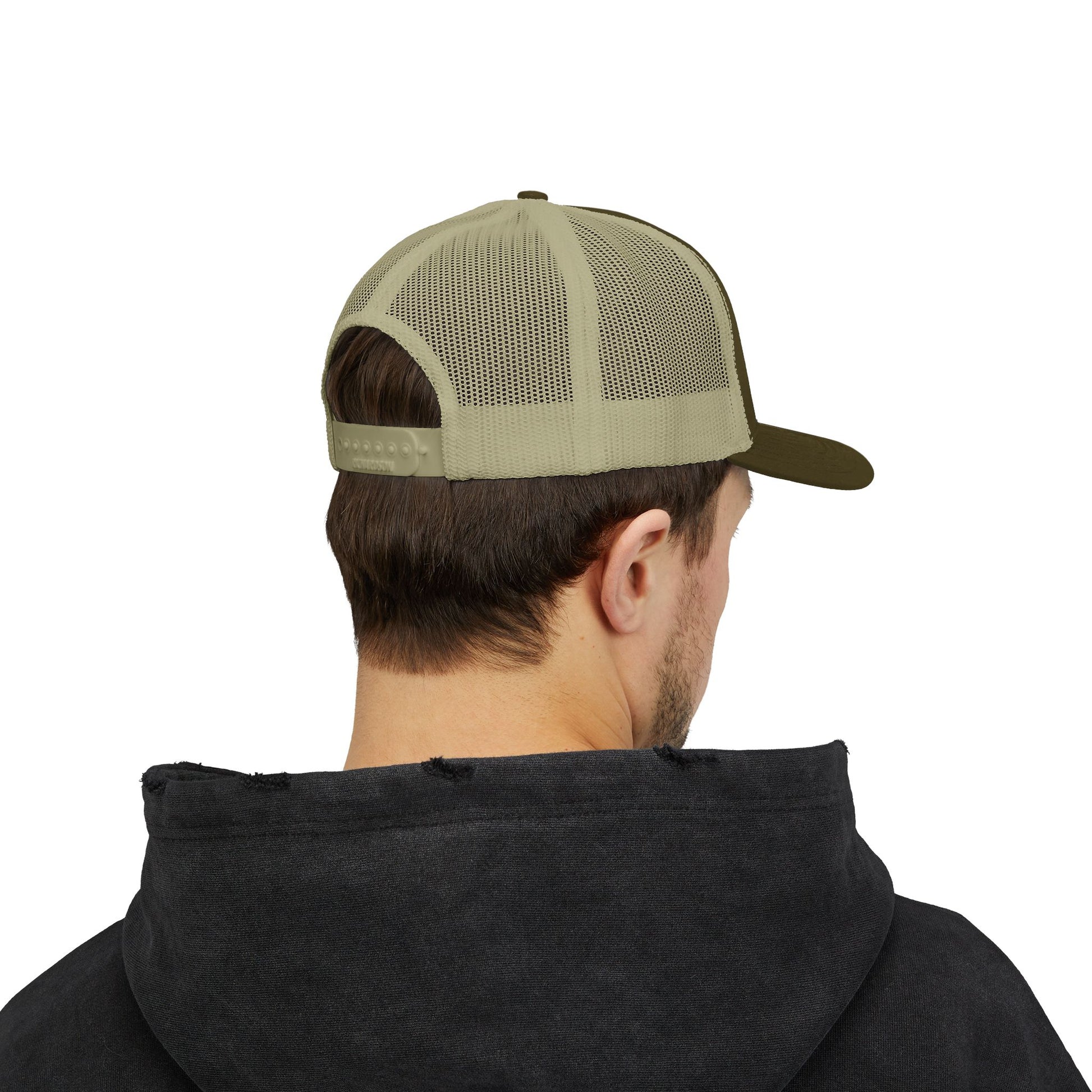 Person wearing a green mesh cap and black hoodie on a white background