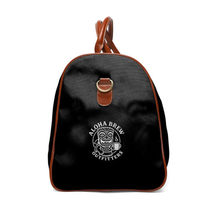 Black backpack with brown straps and 'Aloha Brew Outfitters' logo on a black background