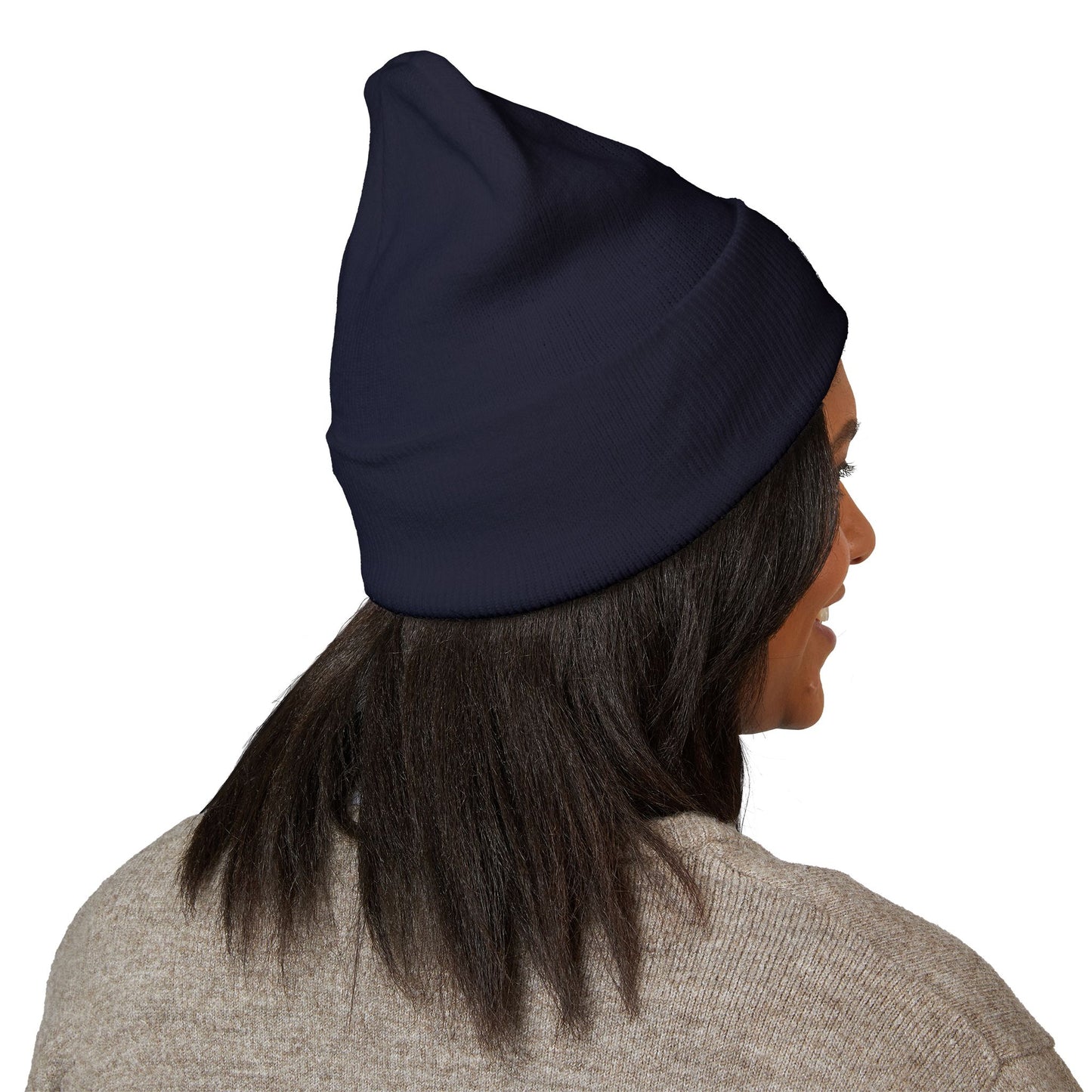 Person wearing a navy blue beanie on a white background