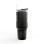 Black tumbler with a straw on a white background