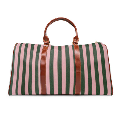 Striped waterproof travel duffle bag with brown leather handles front view