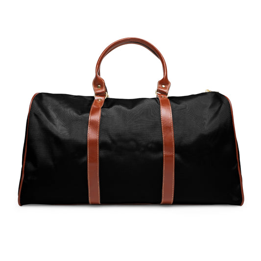 Black duffel bag with brown leather straps on a white background