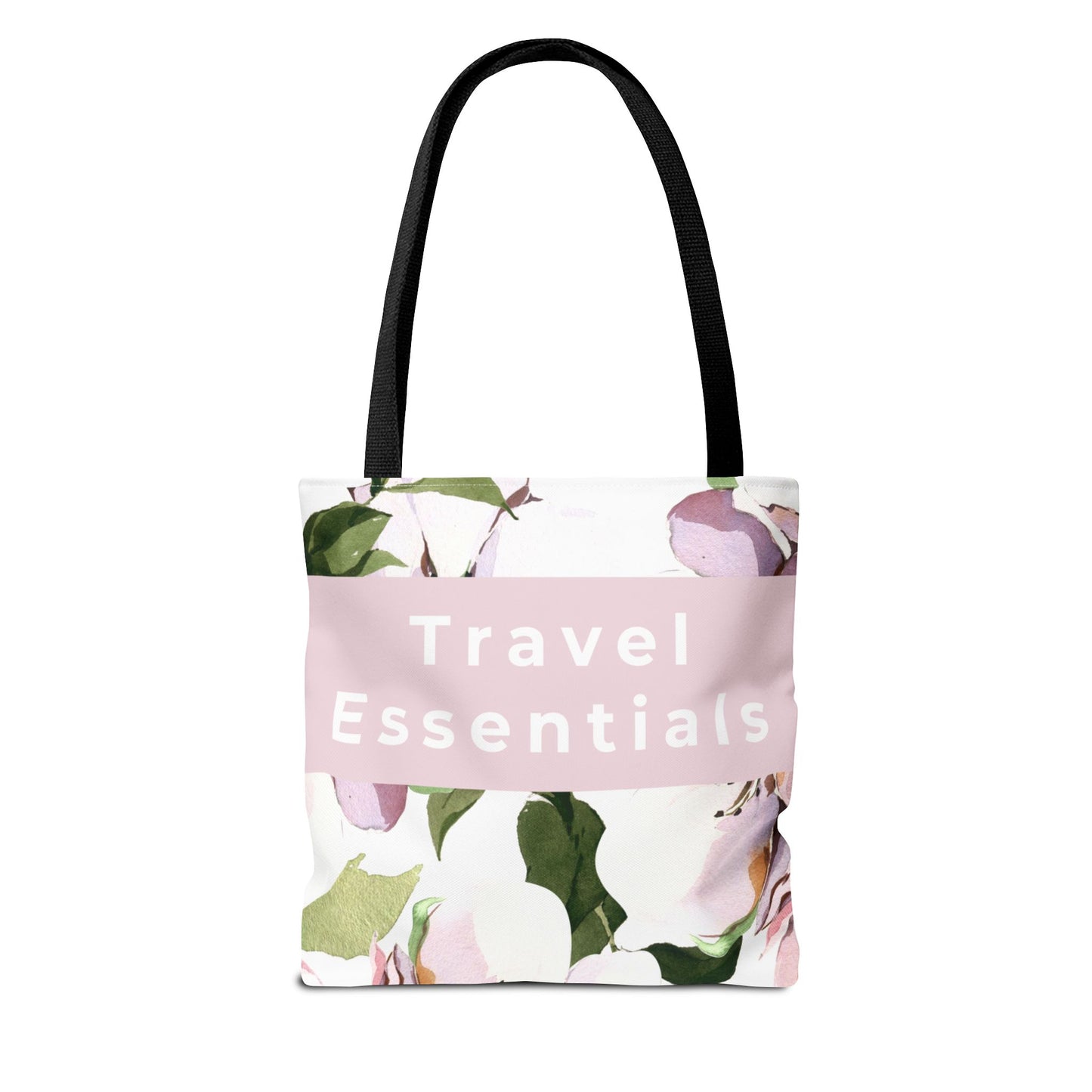 Floral canvas tote bag with “Travel Essentials” text and black handles front view
