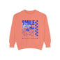 Coral sweatshirt with blue graphic and text on a white background