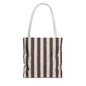 Minimal striped tote bag carried over shoulder for daily errands