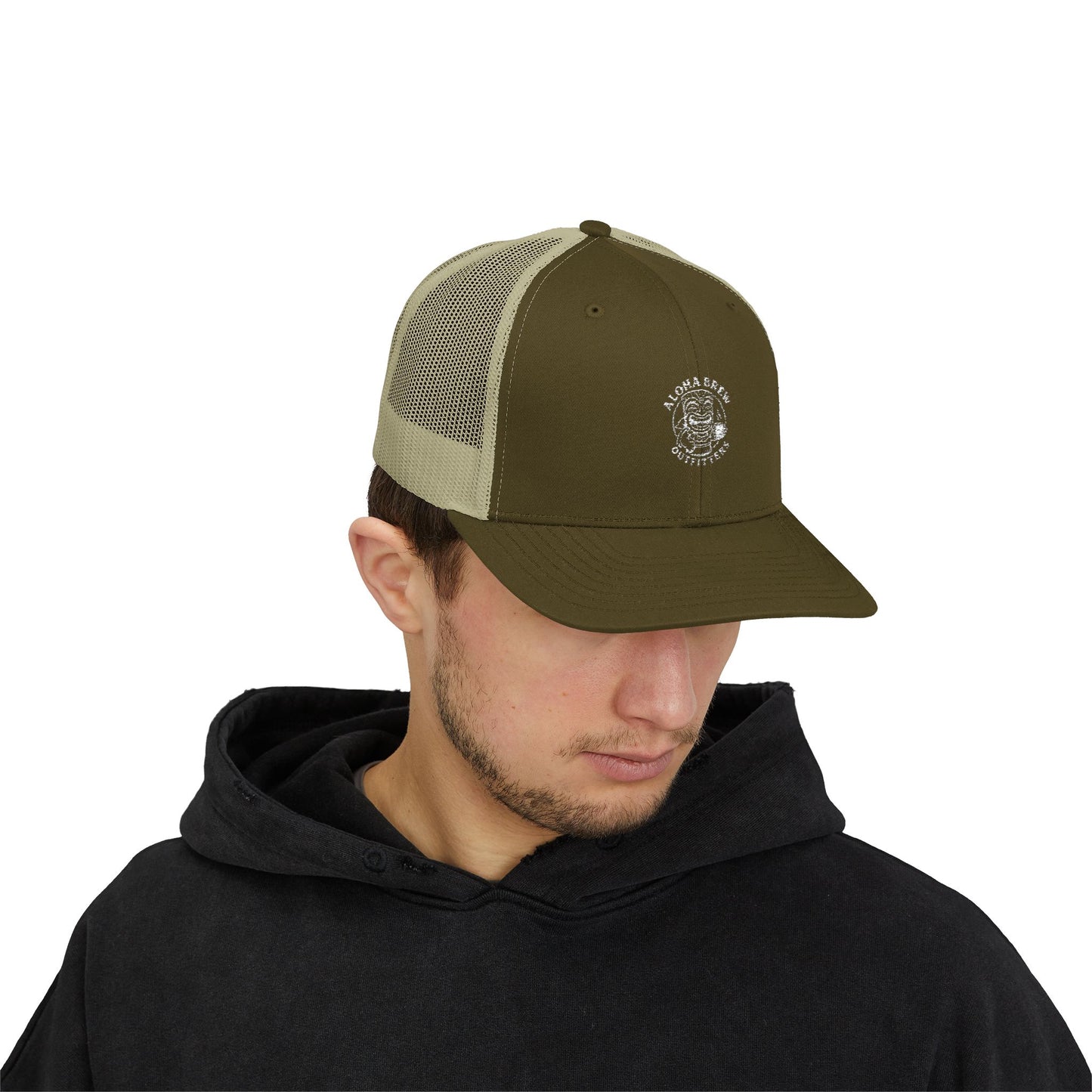 Man wearing a green and beige cap with a logo on a white background